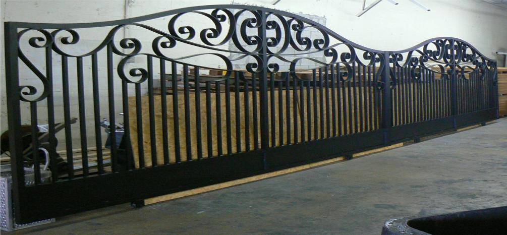 This Large Double Driveway Gate using the Sophie Design with an over all width of 32 feet, These gates are Rolling Gates and were made Automatic